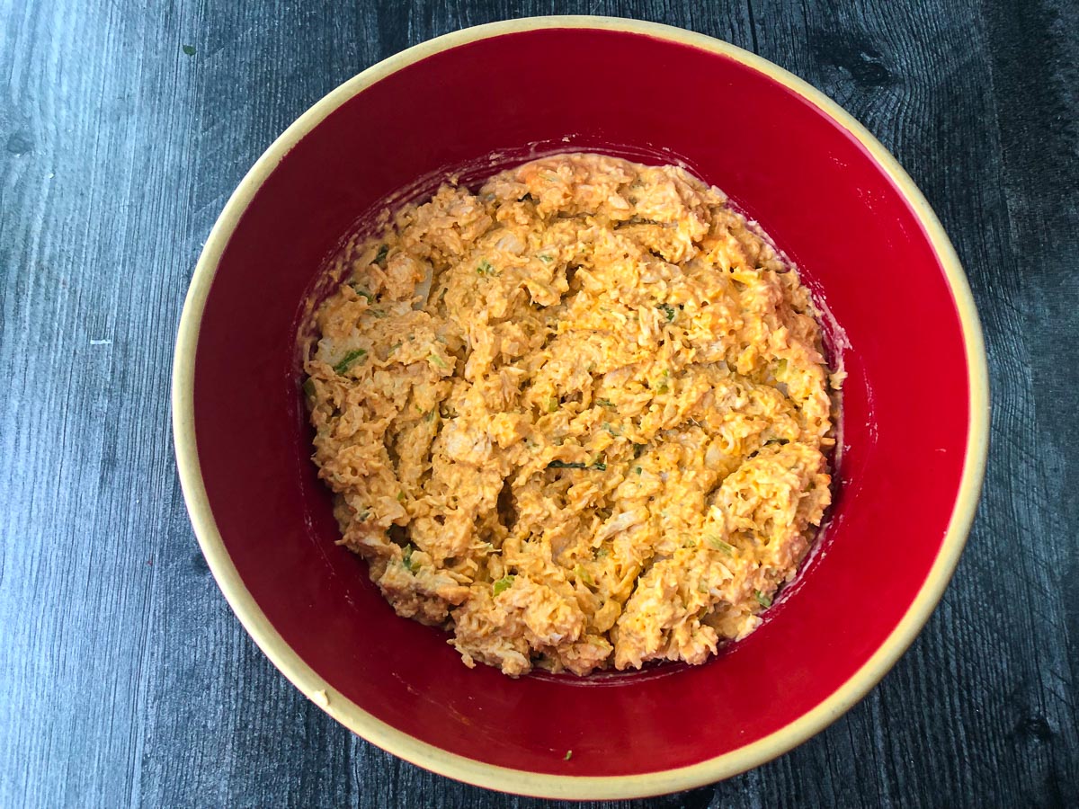 red bowl with finished spicy chicken spread