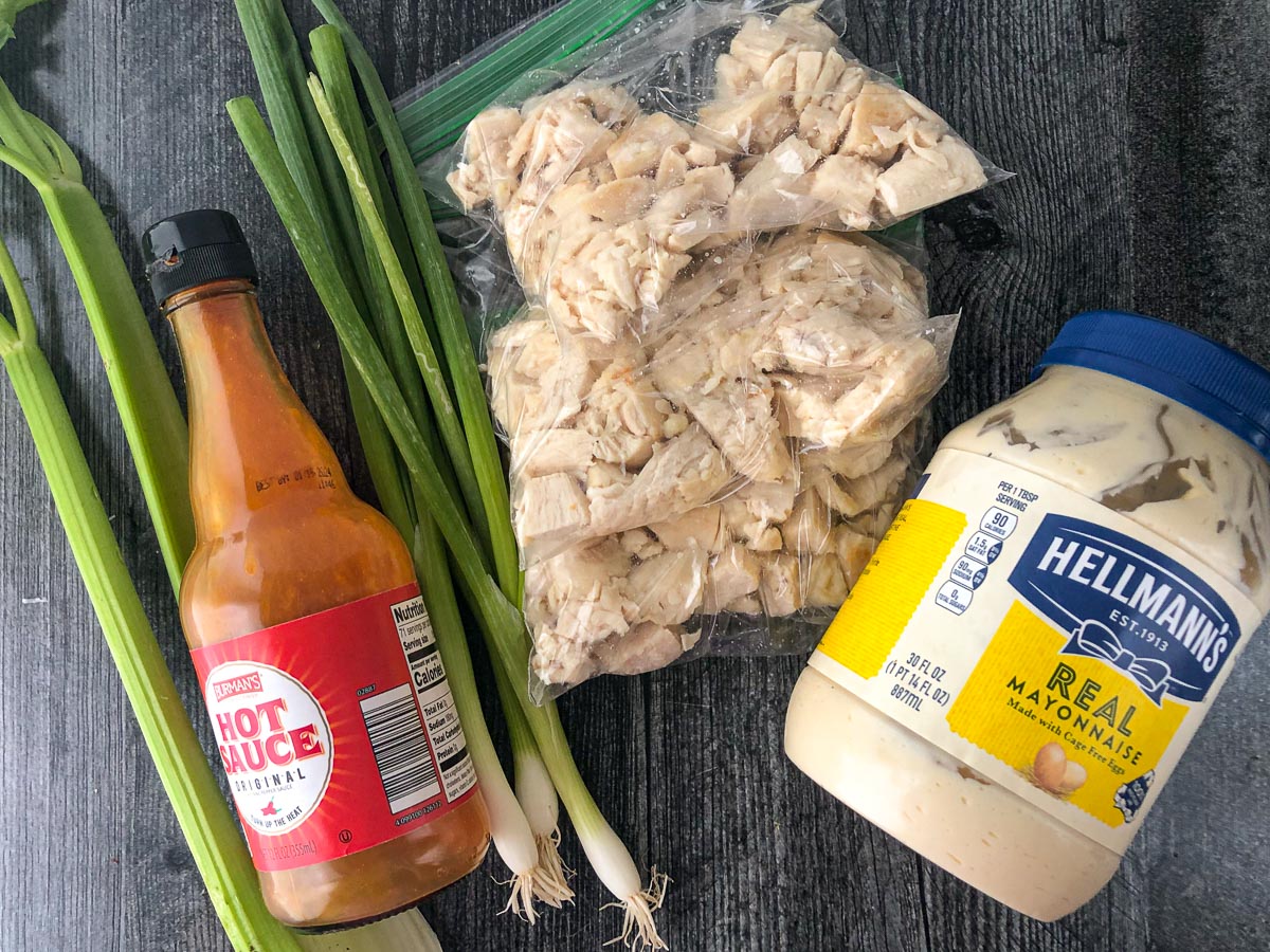 recipe ingredients - celery, green onions, chicken chunks, hot sauce and mayo