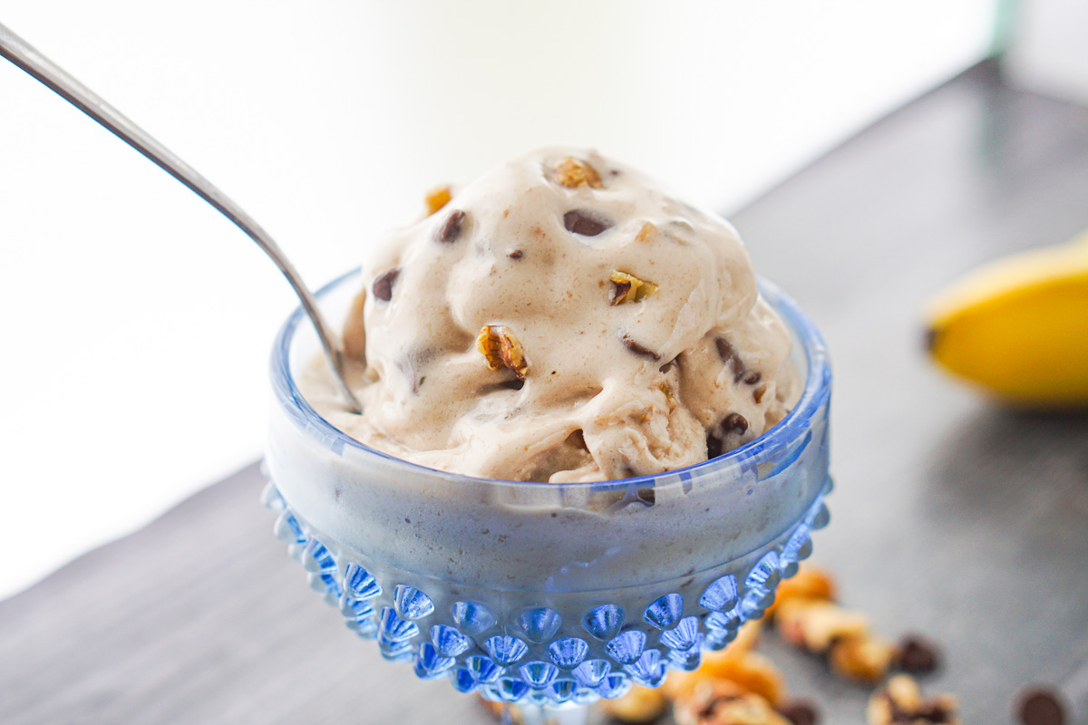 blue glass bowl with chunky monkey ice cream