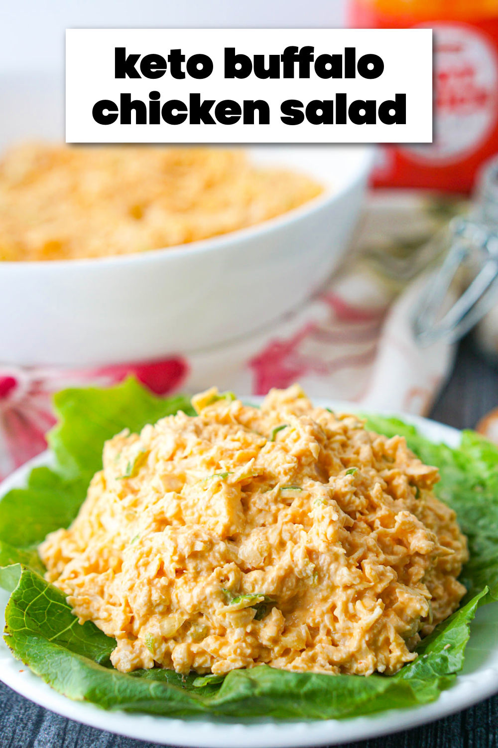 white bowl and plate with buffalo chicken salad with hot sauce and text