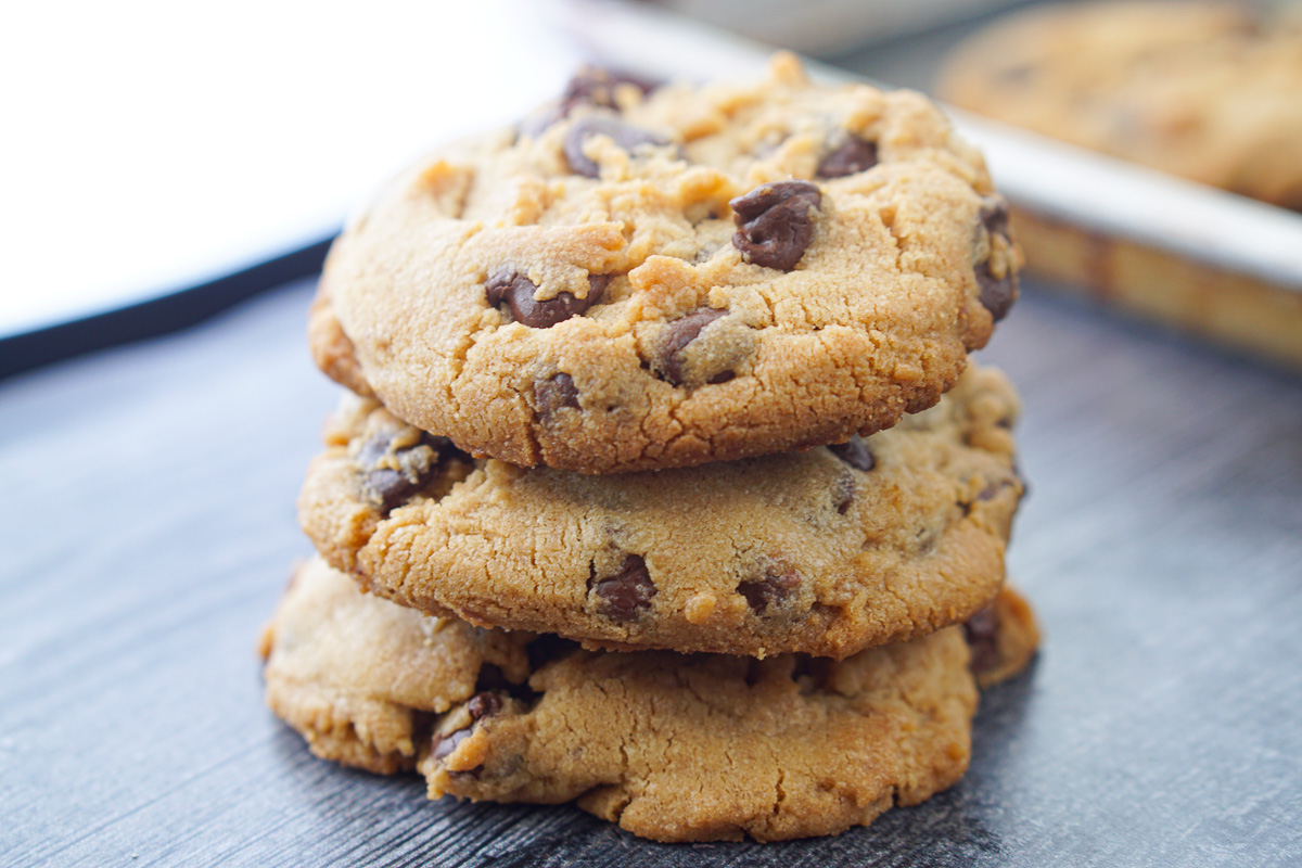 a stack of 3 chocolate chips cookies with peanut butter