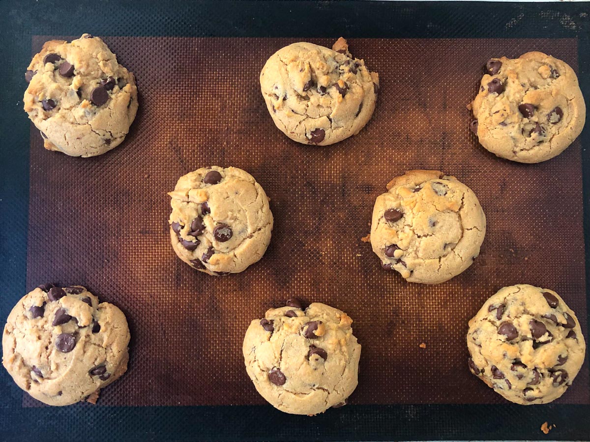 baking sheet with finished peanut butter chocolate chip cookies