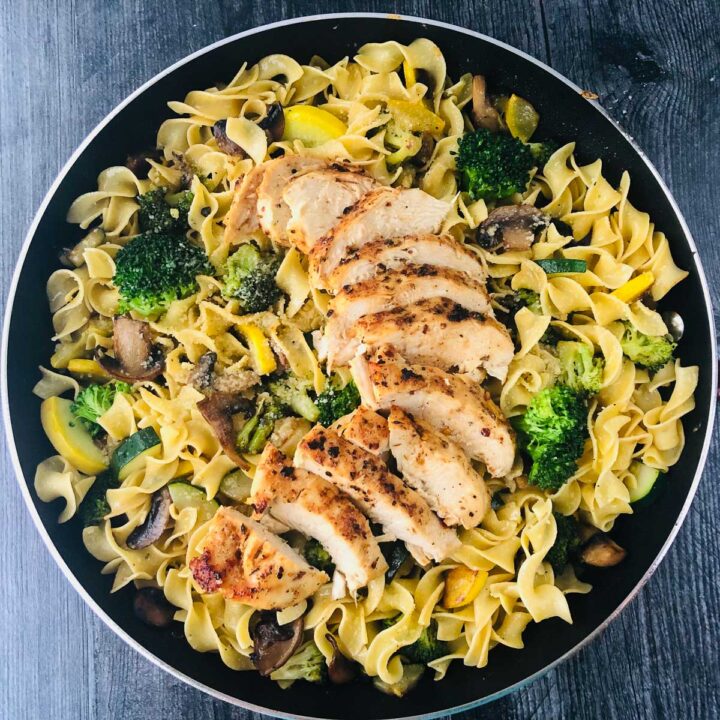 pasta prima vera with chicken in a skillet