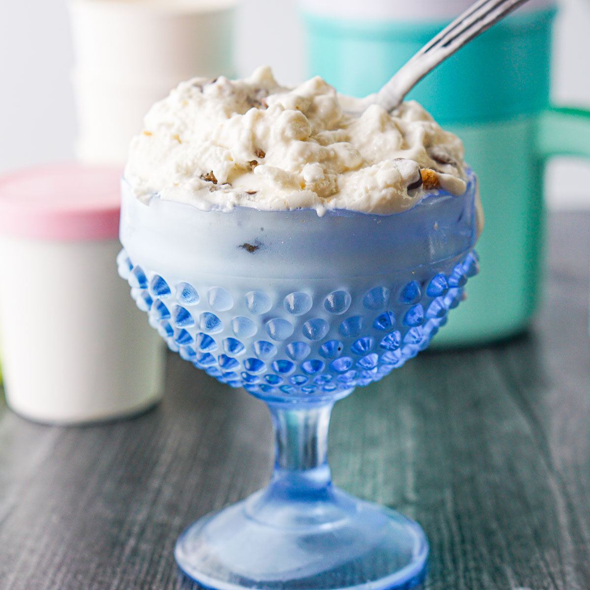 blue dish with keto sot serve ice cream and a spoon