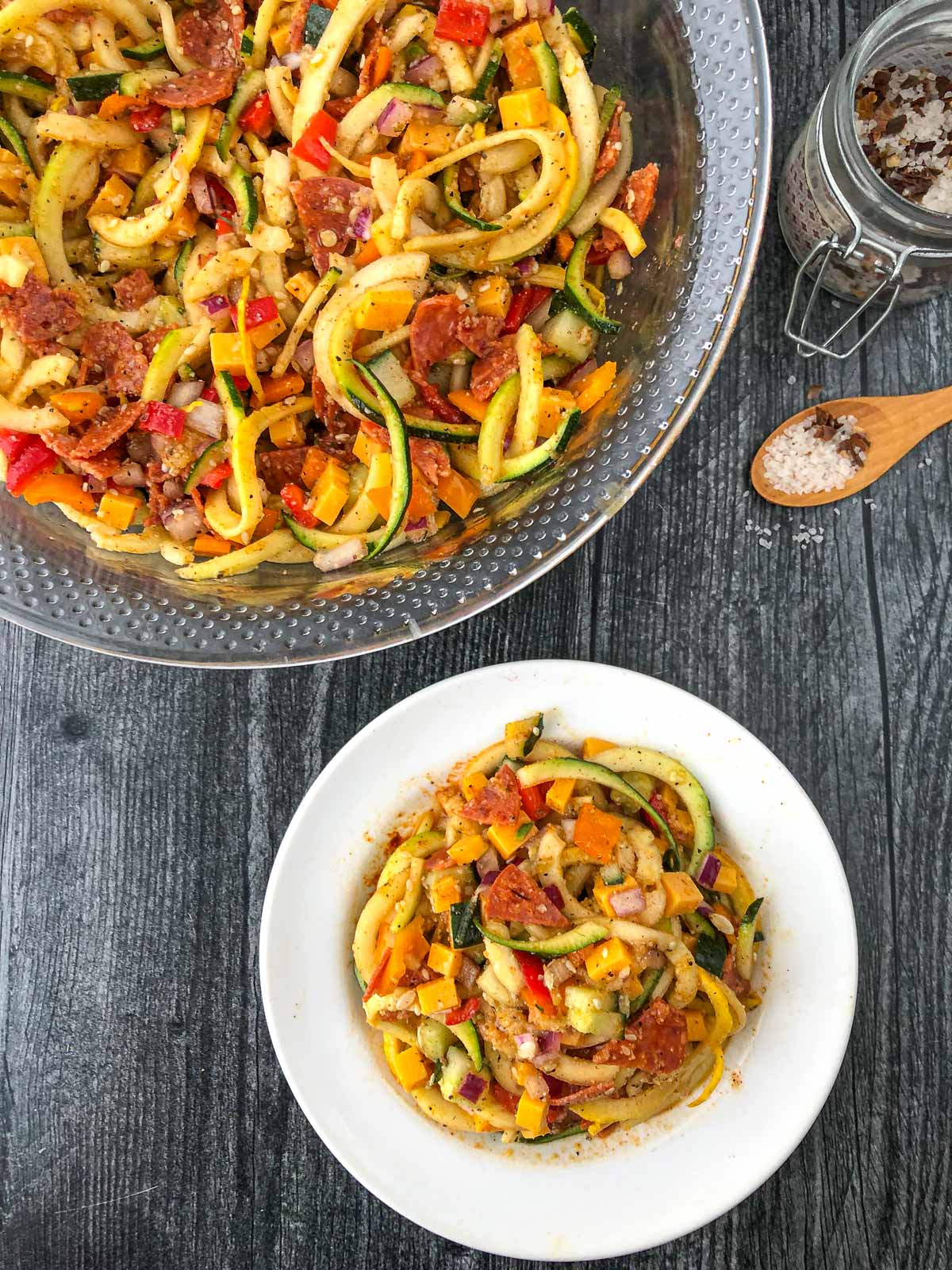 bowl and plate with keto zucchini pasta salad