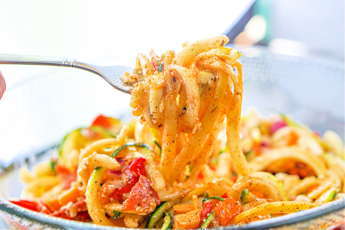 a forkful of zucchini pasta noodles salad