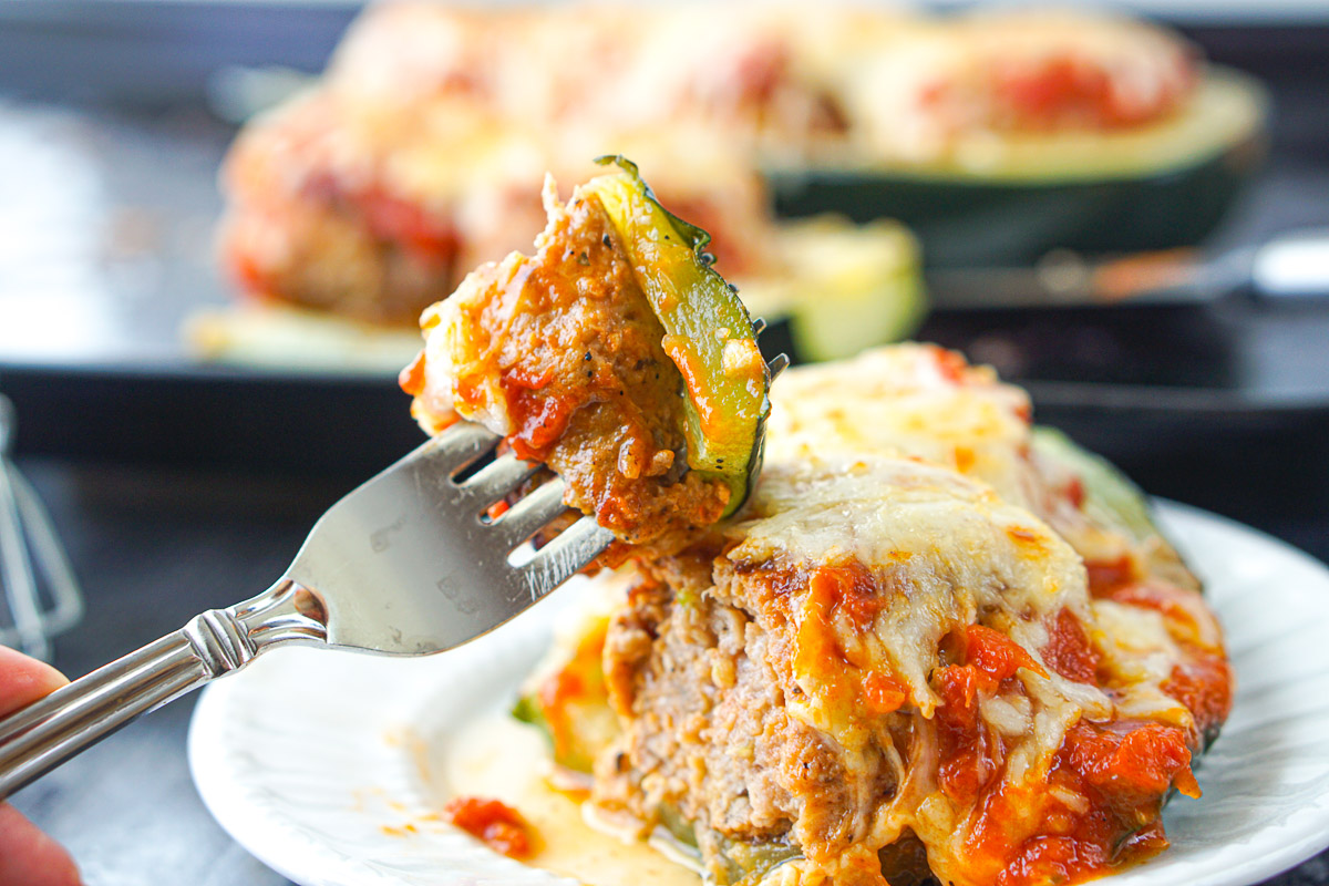 a forkful of low carb zucchini boat with meatballs