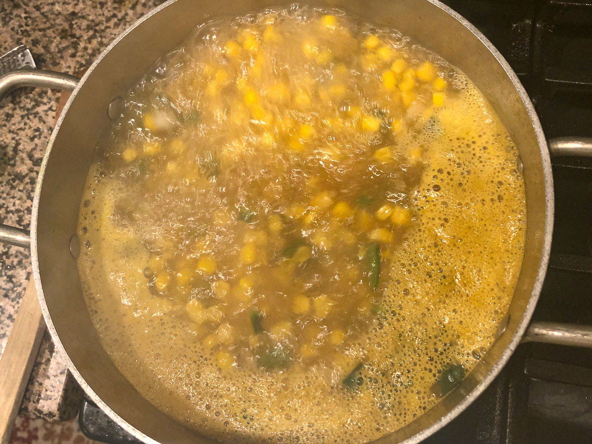 pot with corn soup cooking