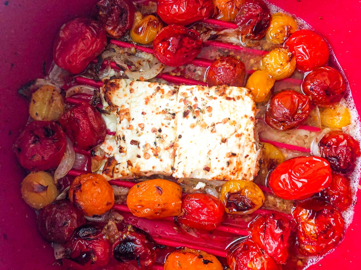 air fryer basket with baked feta with tomatoes and spices