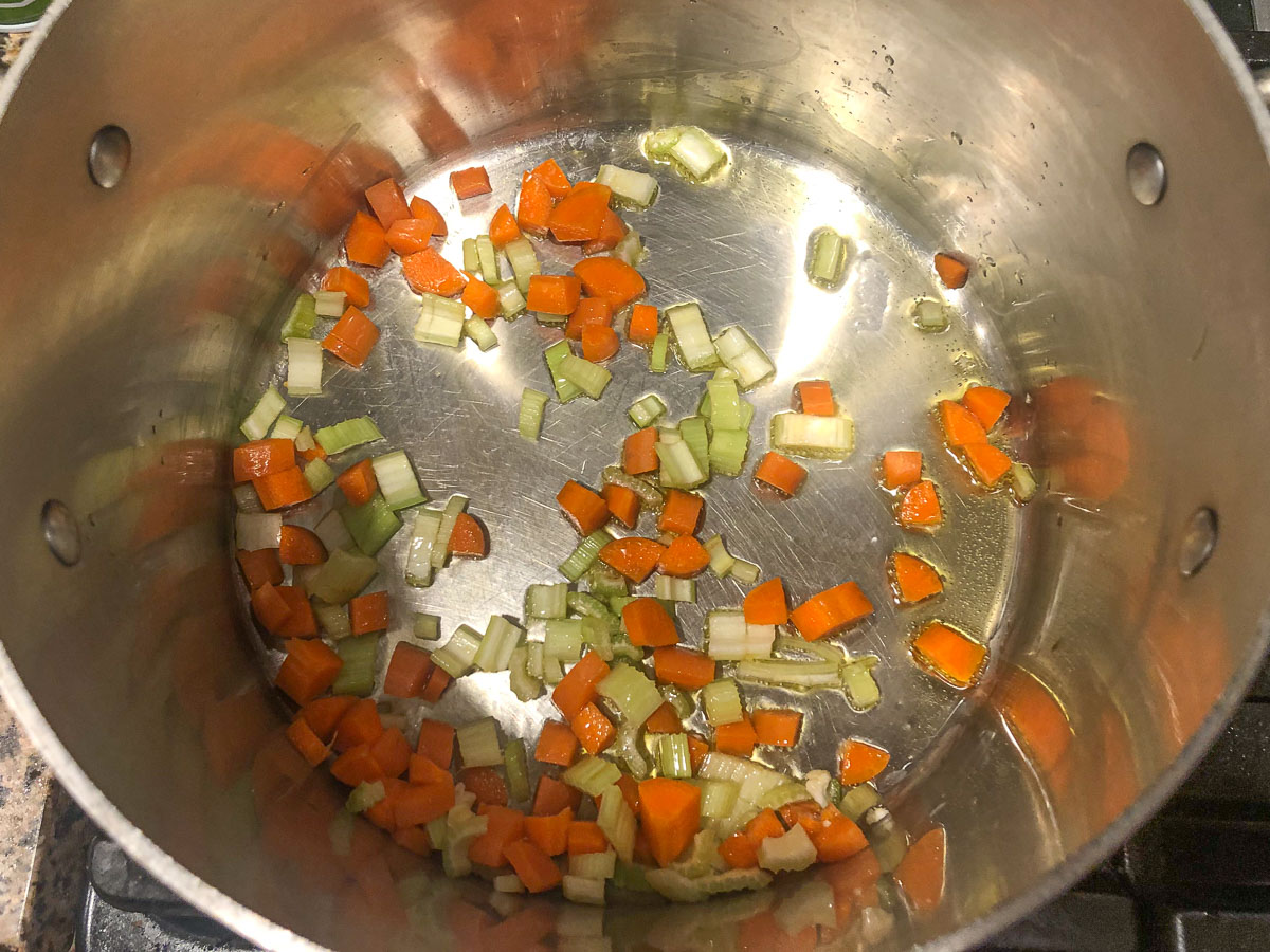 pot with chopped carrots and celery