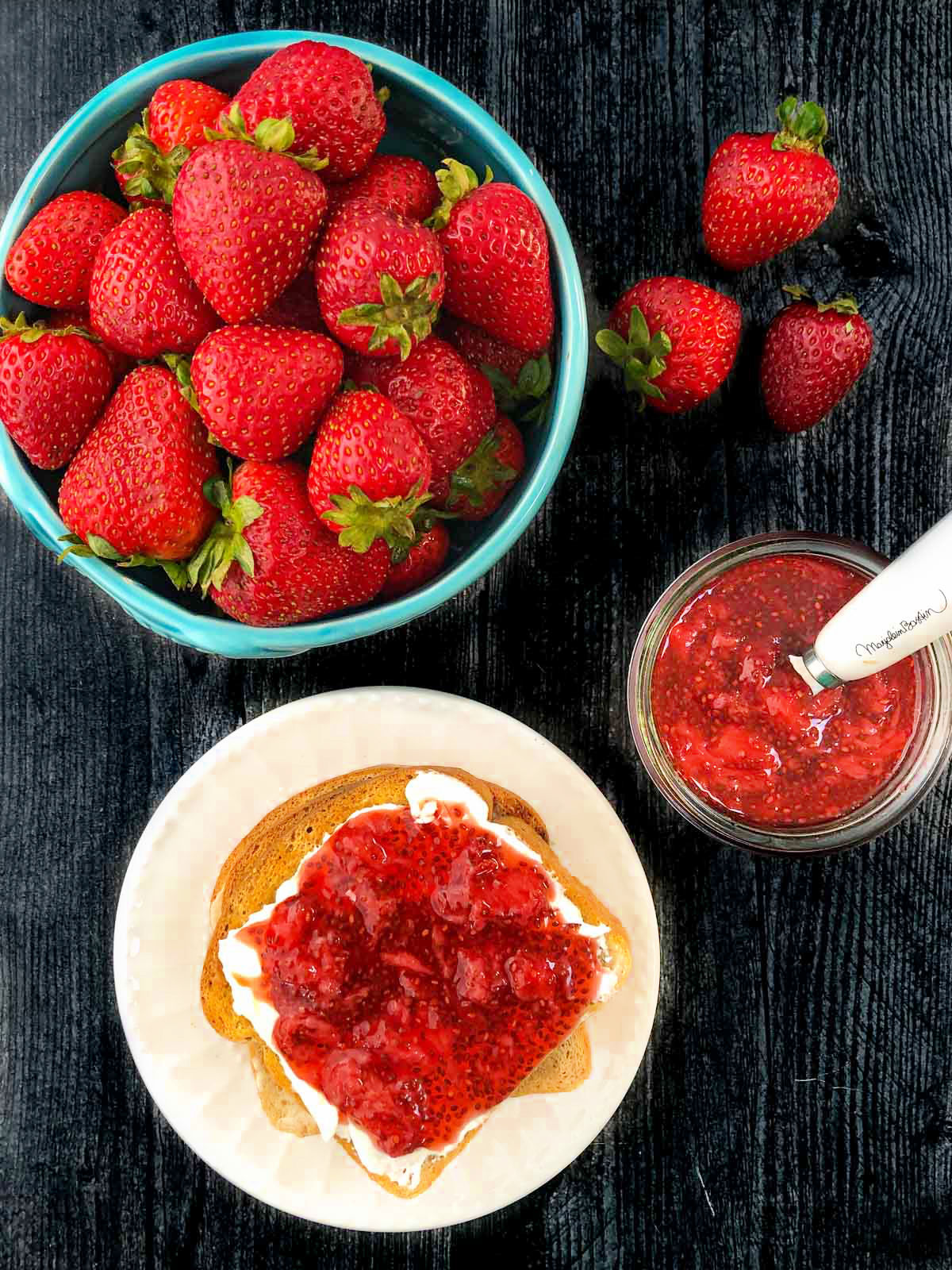 aerial view of fresh strawberries and toast with strawberry jam