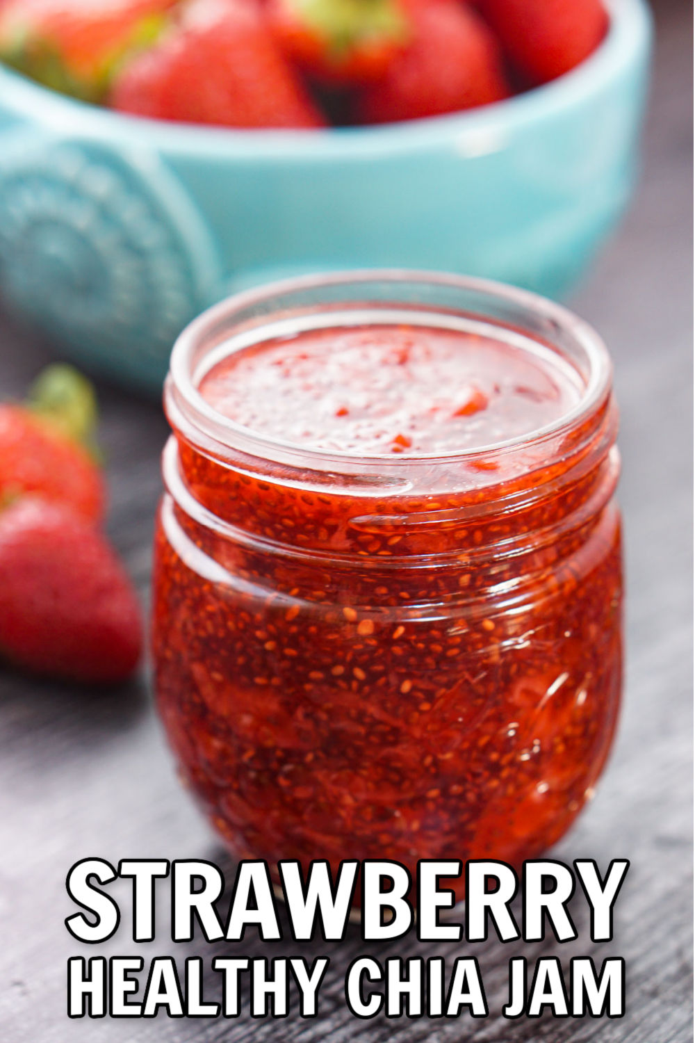 jar of sugar free strawberry chia jam with fresh strawberries in the background with text