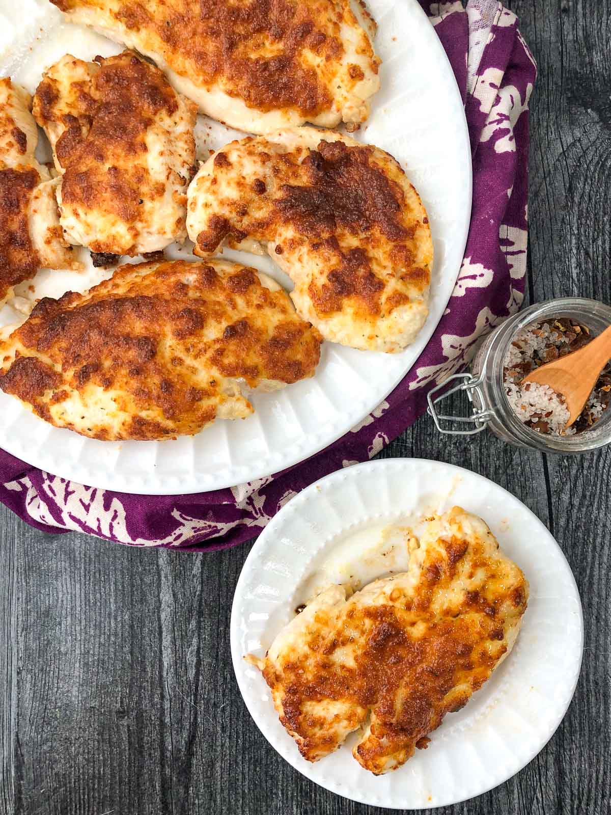 aerial view of two white plates with the finished keto ranch chicken