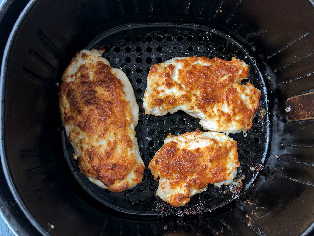 air fryer basket with finished keto chicken breast