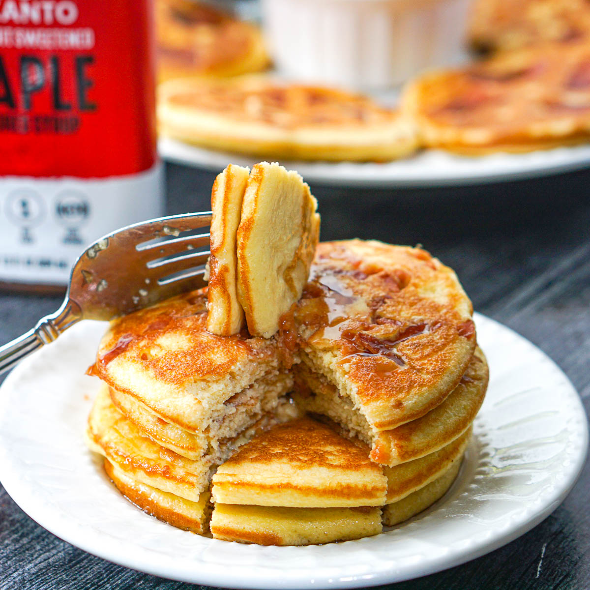 stack of sugar free bacon pancakes with a fork