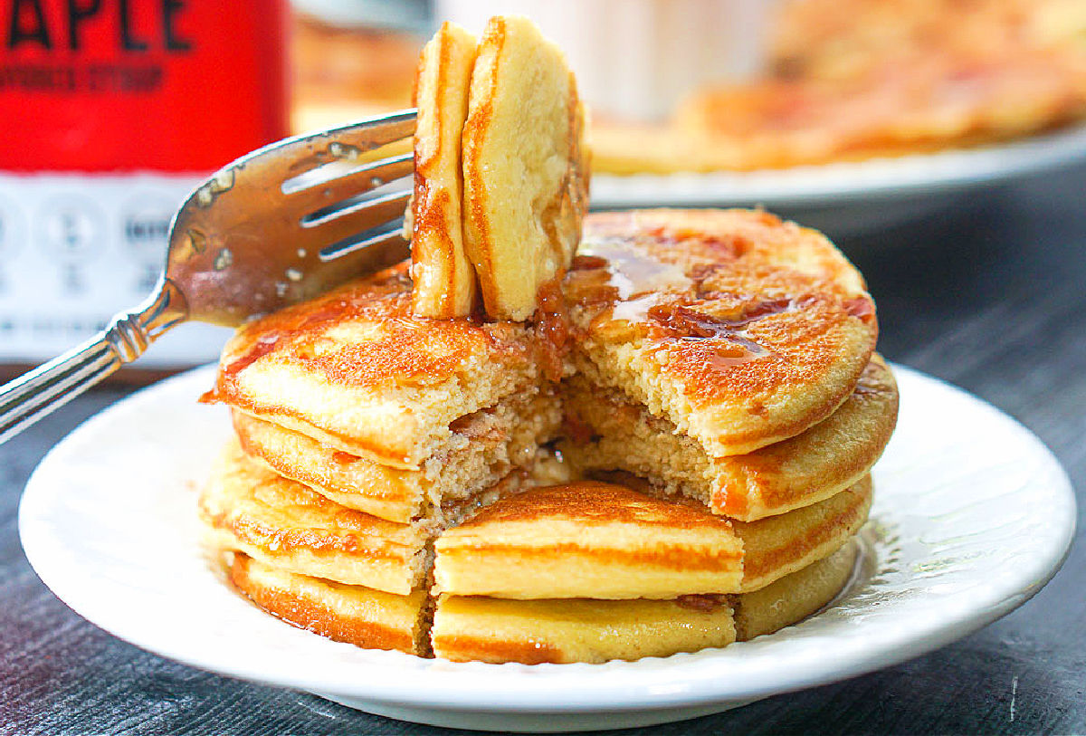 closeup of a forkful of bacon gluten free pancakes