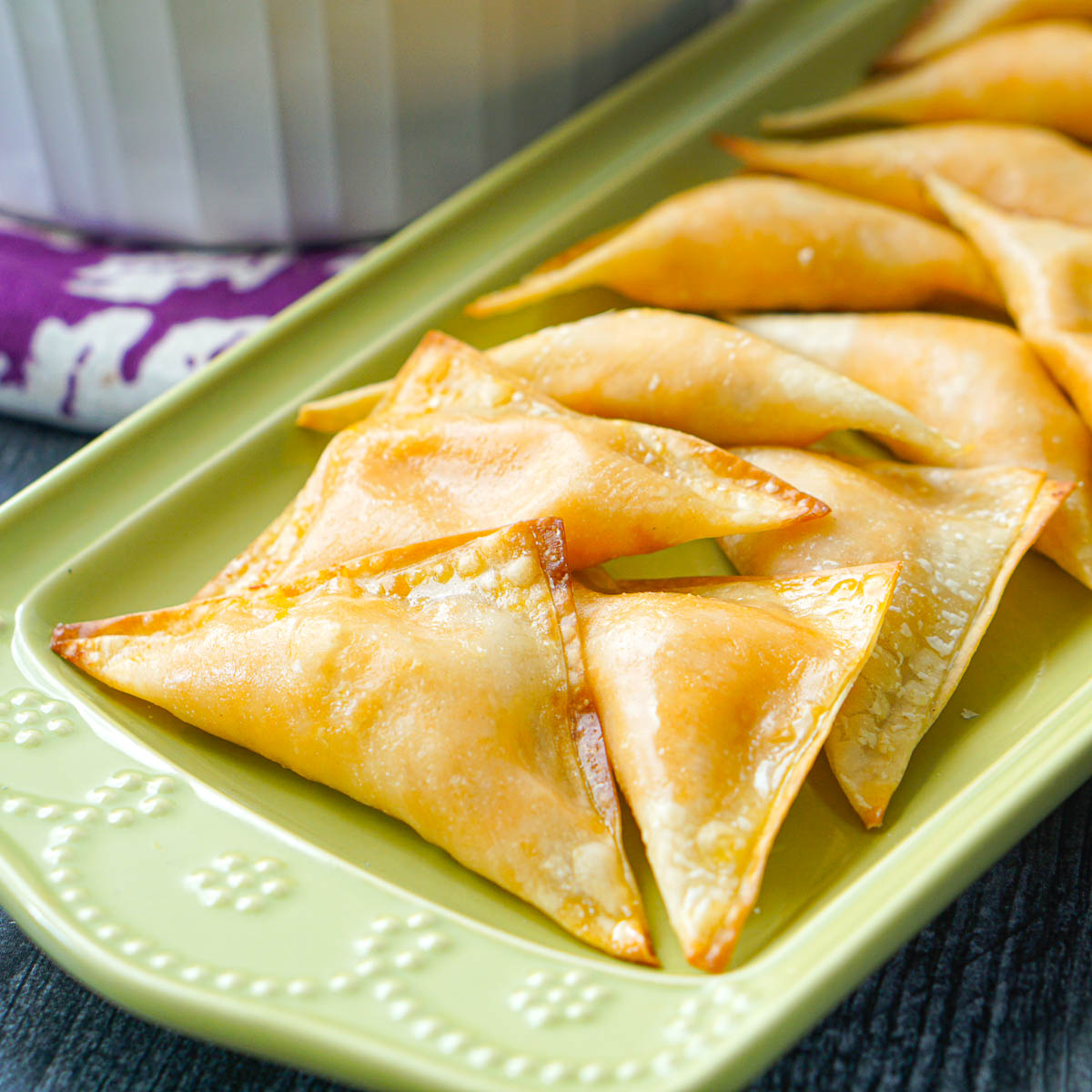 closeup of green platter with buffalo wontons