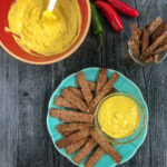 keto pretzels dipped in hot pepper mustard on a plate and text