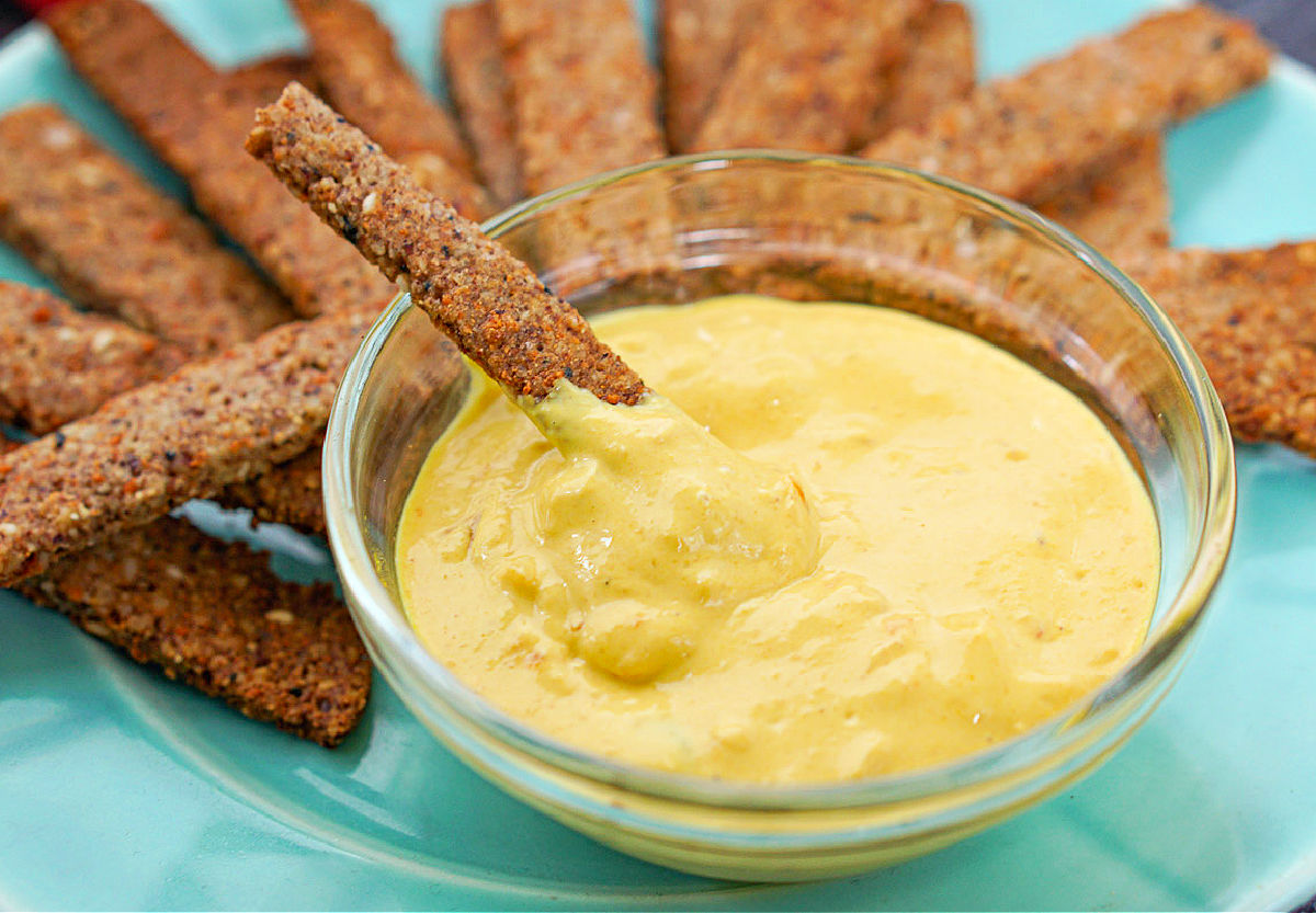 keto pretzels dipped in hot pepper mustard on a plate