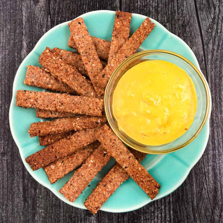 aqua plate with keto pretzel sticks and spicy mustard