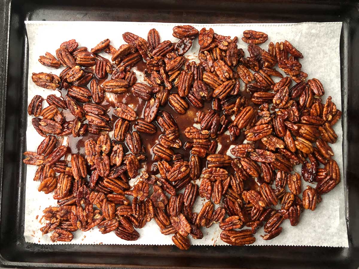 cookie sheet with candied nuts drying