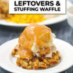closeup of white plate with stuffing waffle topped with mashed potatoes and gravy and text