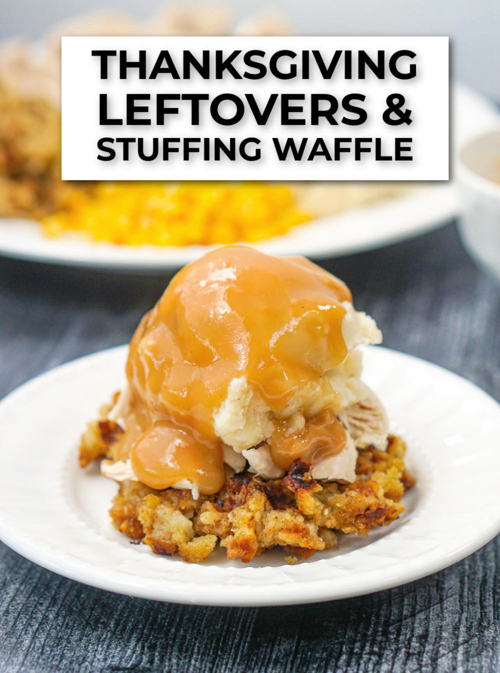 closeup of white plate with stuffing waffle topped with mashed potatoes and gravy and text