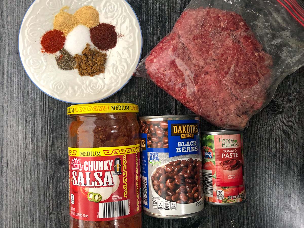 recipe ingredients - spices, ground beef, salsa, black beans and tomato paste