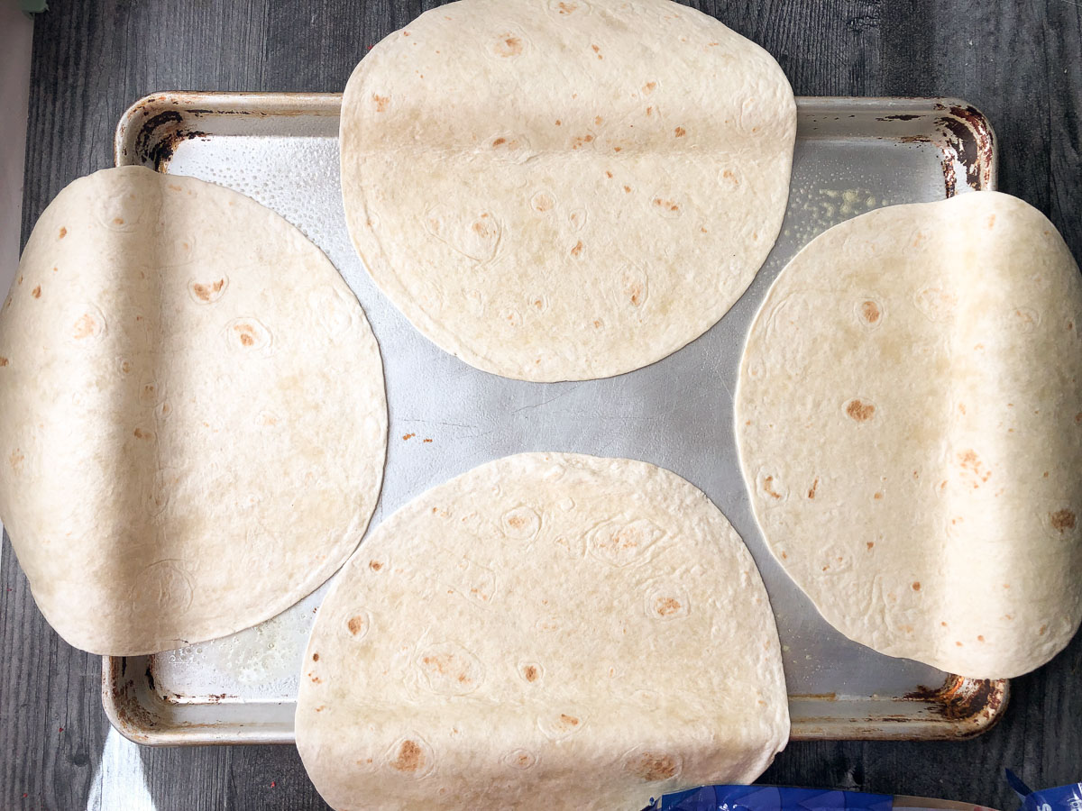 sheet pan with 4 large flour tortillas
