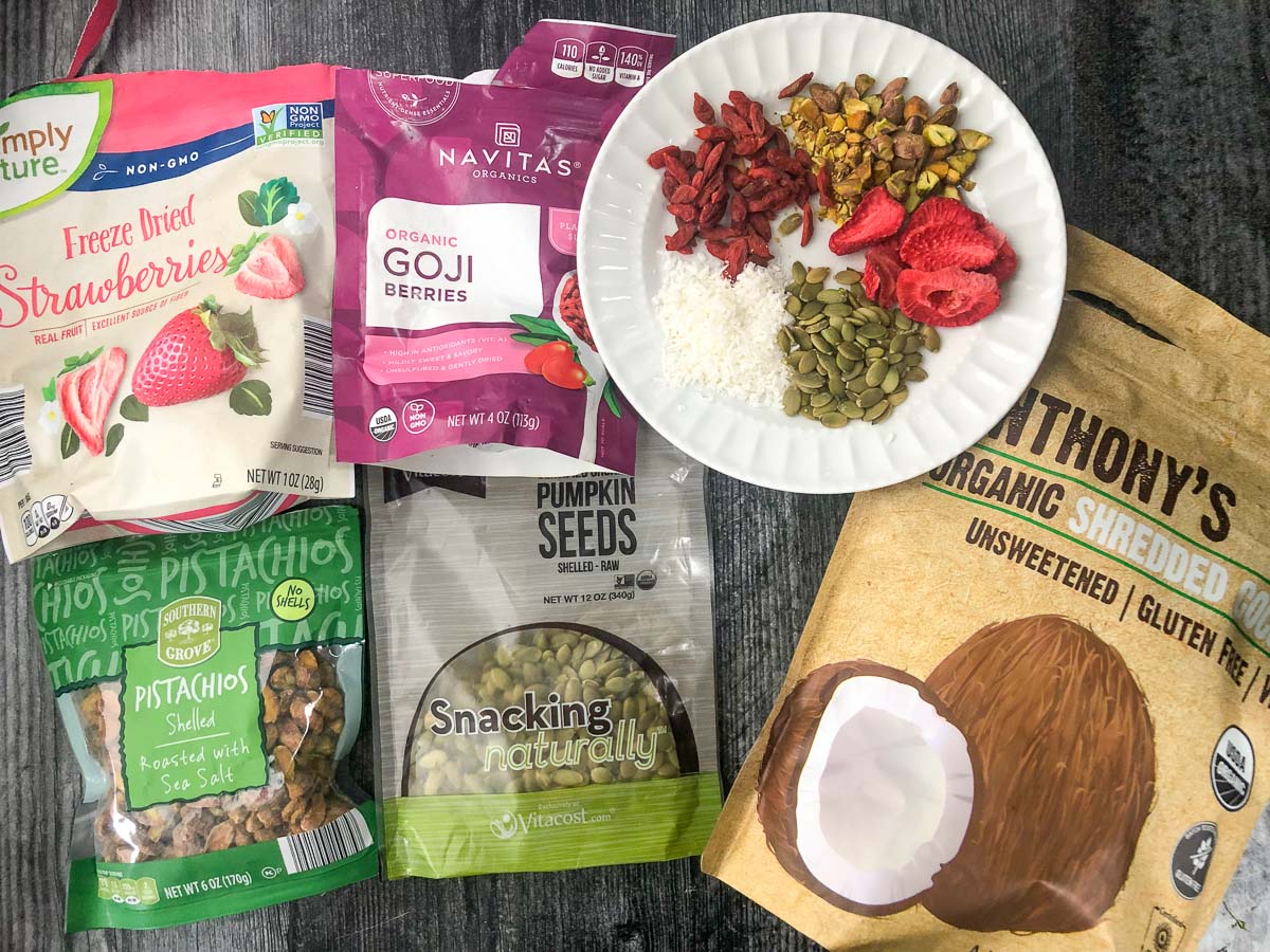 healthy ingredients to add to bark - pepitas, goji berries, dehydrated strawberries, coconut and pistachios
