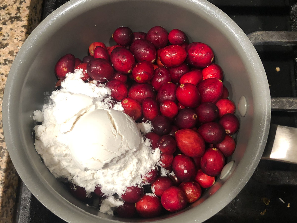 sauce pan with sweetener and cranberries