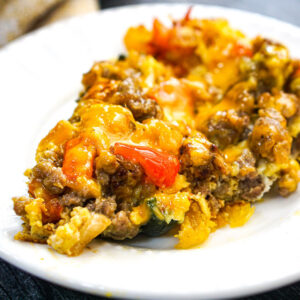 Closeup of a white plate with a serving of keto breakfast casserole.