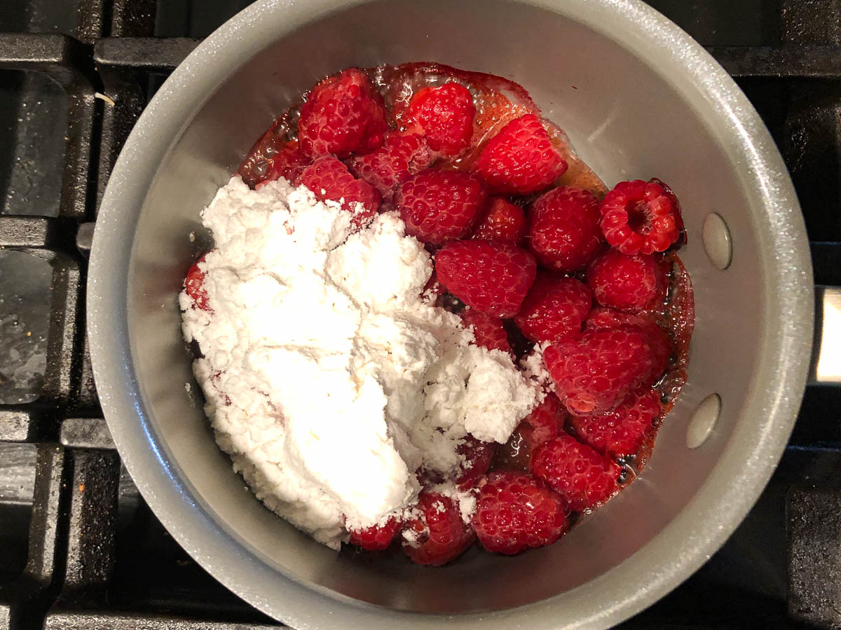 pan with raspberries and sweetener
