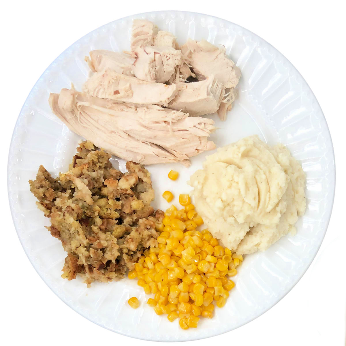 white plate with turkey, mashed potatoes, stuffing and corn