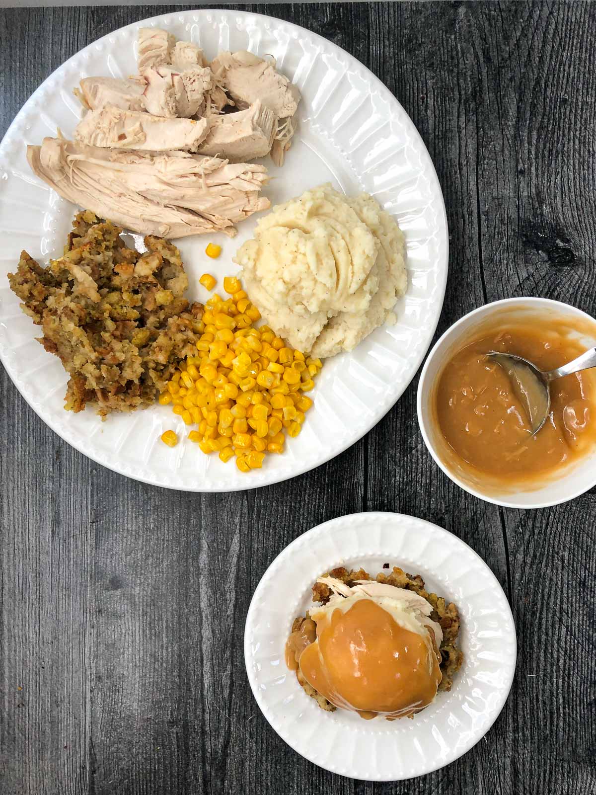 aerial view of white plate with thanksgiving leftovers and stuffing waffle and gravy