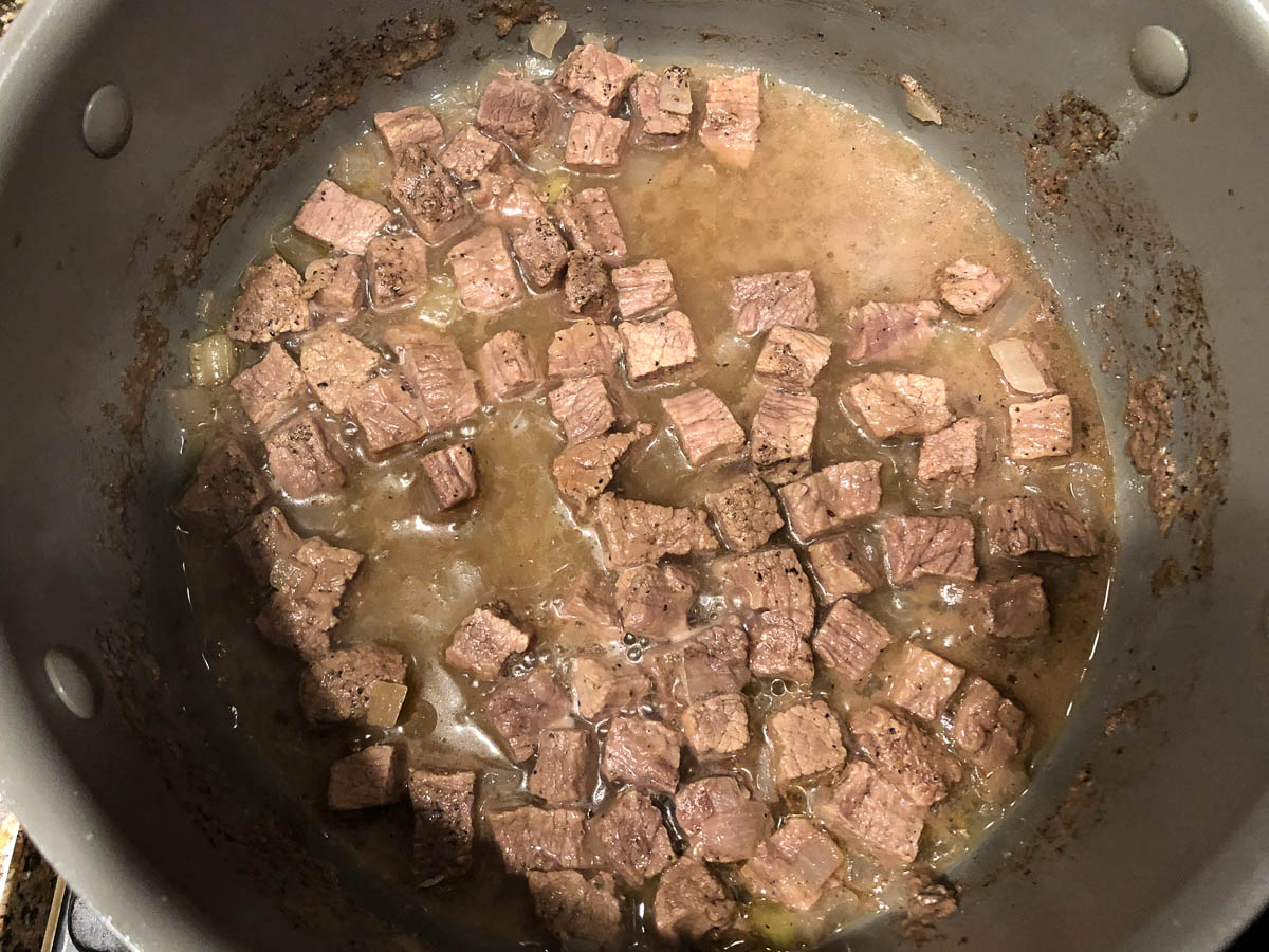 soup pan with beef cubes and broth