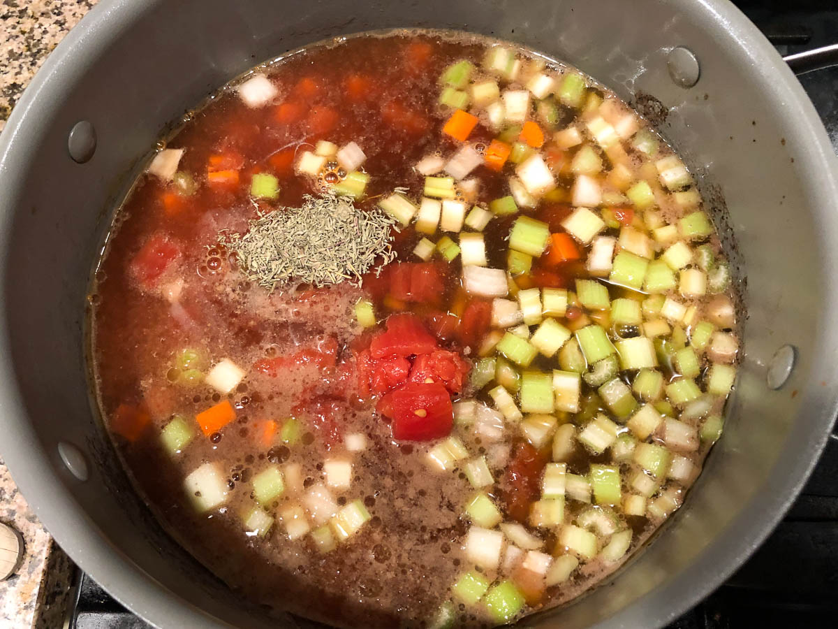 soup pan with veggies and spices added