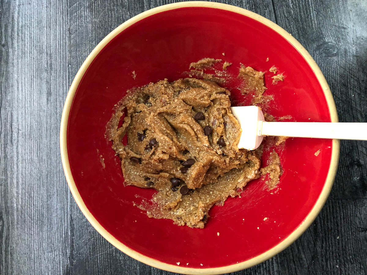 red bowl with cookie dough batter