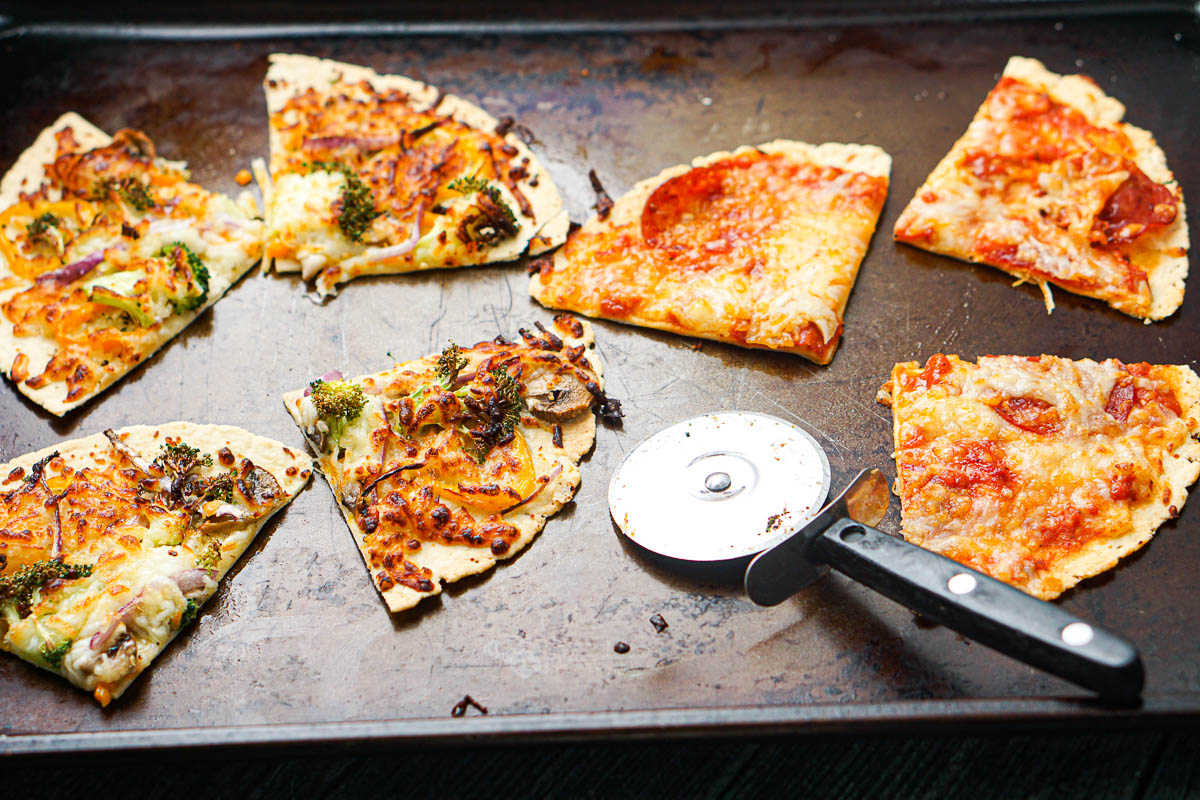 baking sheet with cut up keto tortilla pizzas