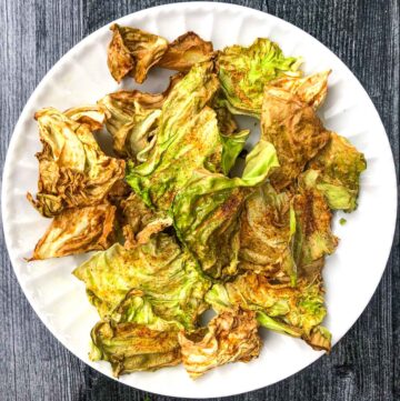 white plate with air fryer cabbage chips
