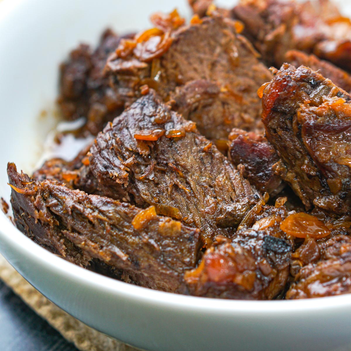 a white bowl of keto pot roast made in the slow cooker