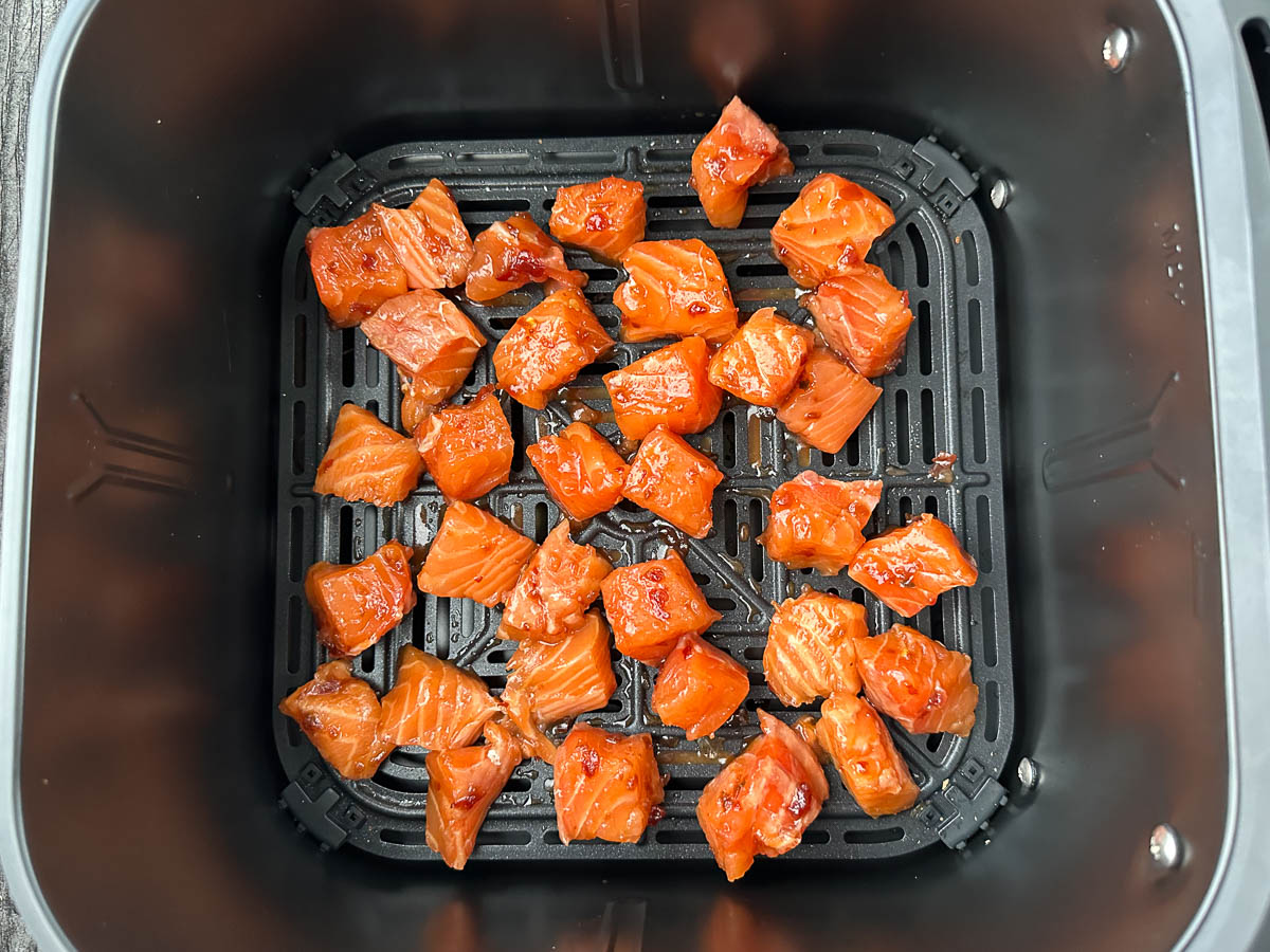 air fryer basket with marinated fish bites