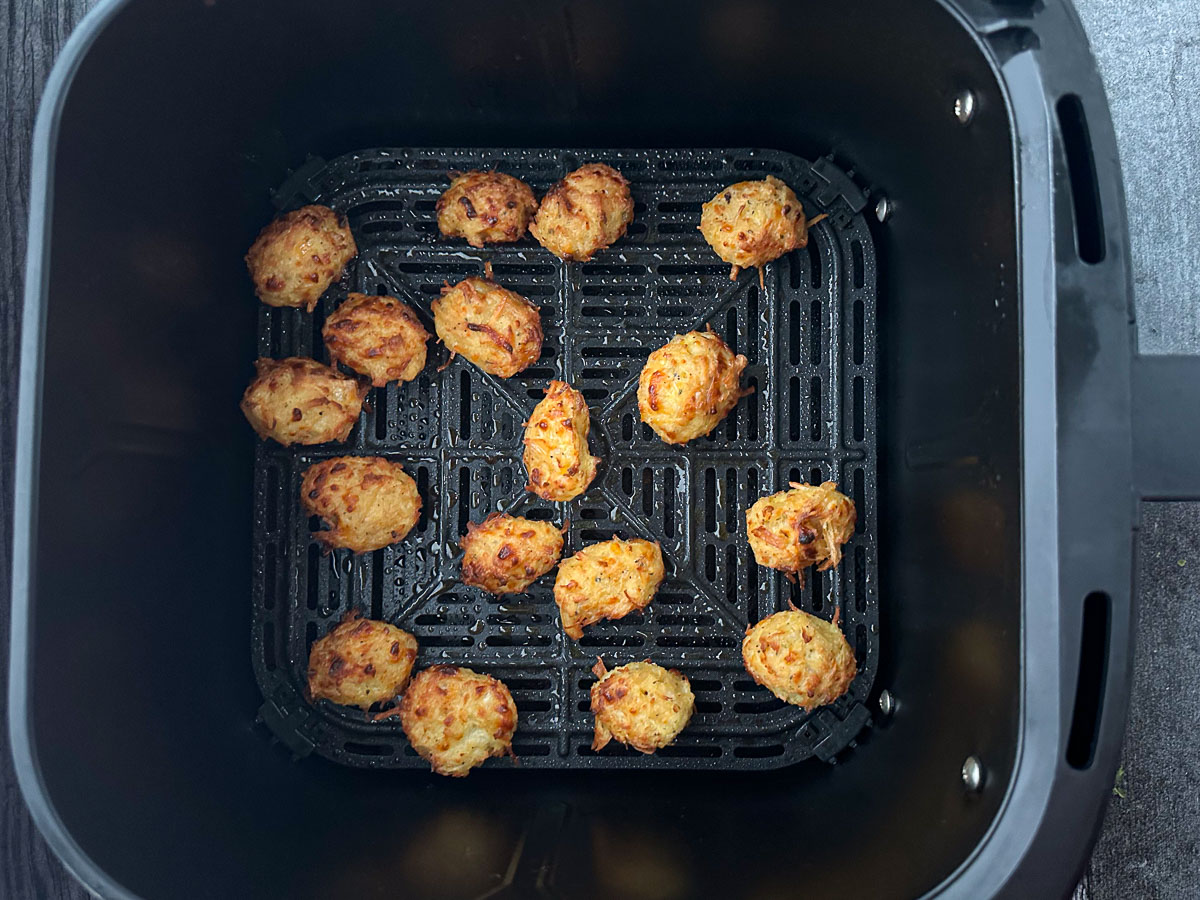 air fryer basket with cooked canned chicken nuggets