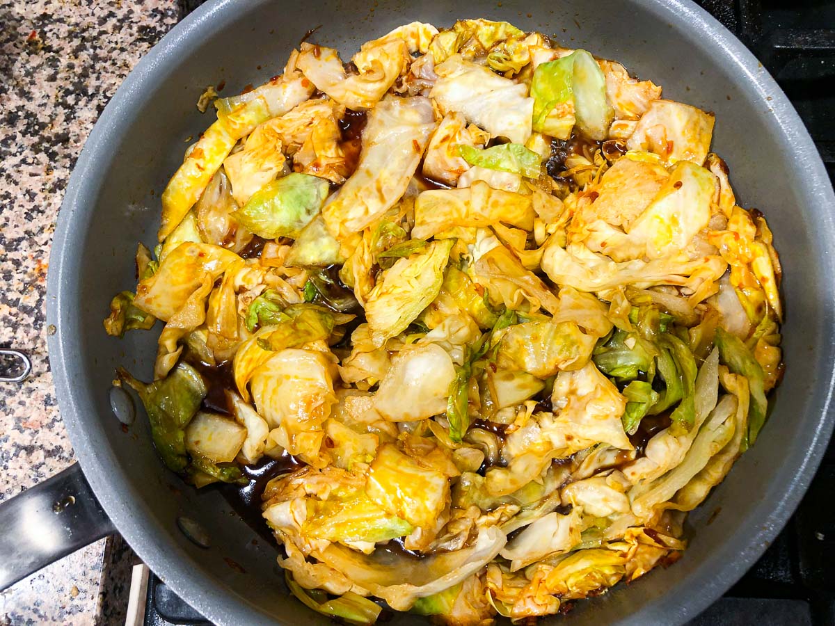 pan with sauce and cabbage