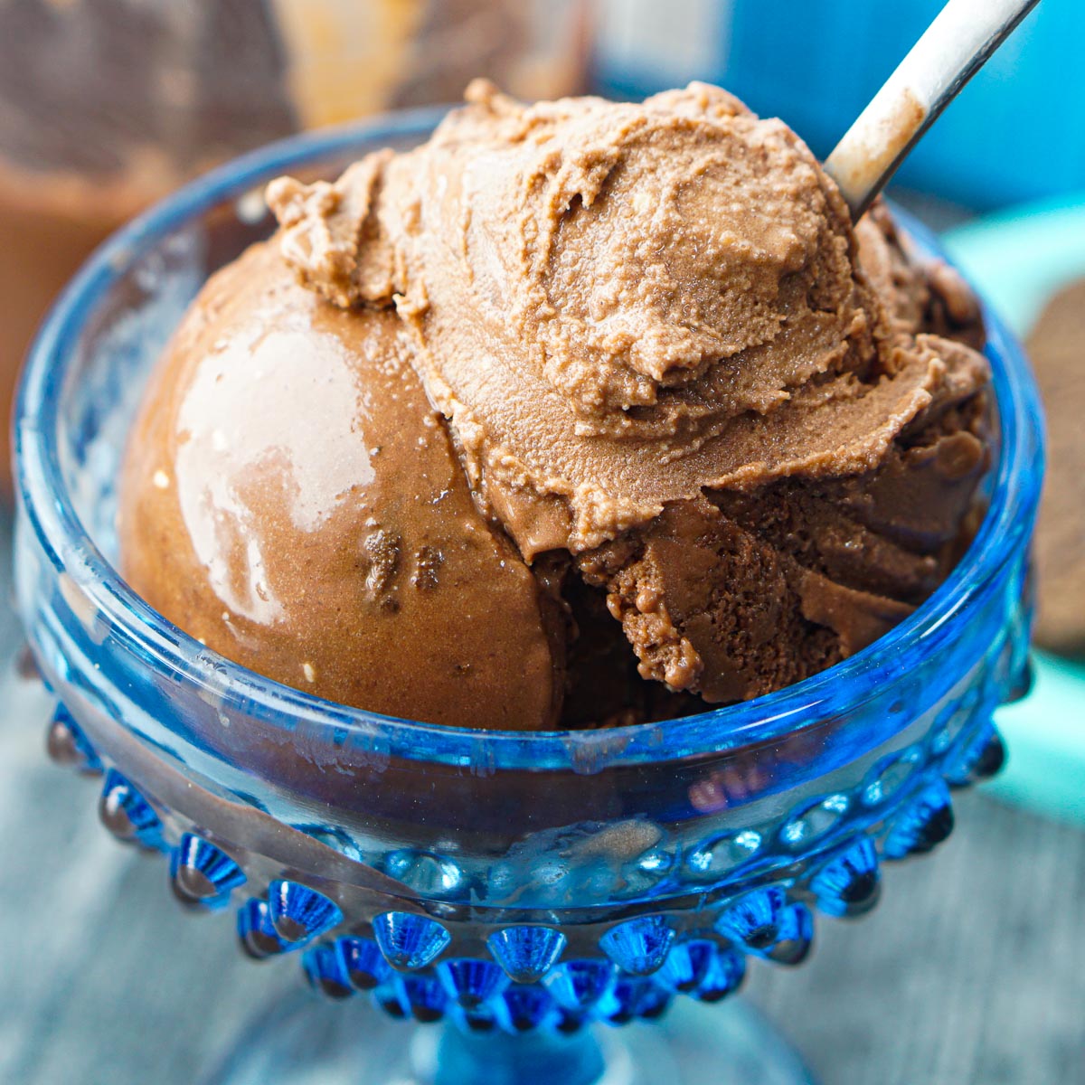 closeup of blue bowl with scoops of Ninja Creami chocolate ice cream 