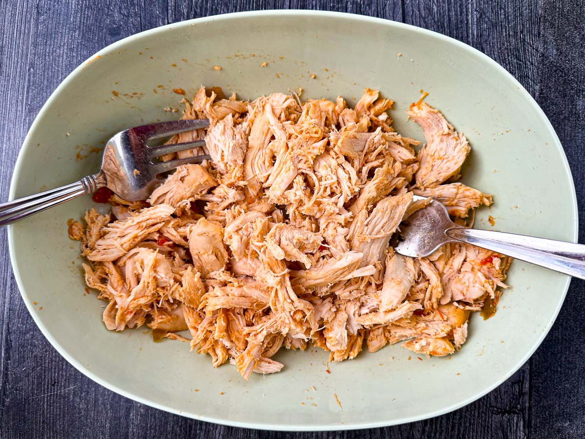 bowl with shredded cooked chicken