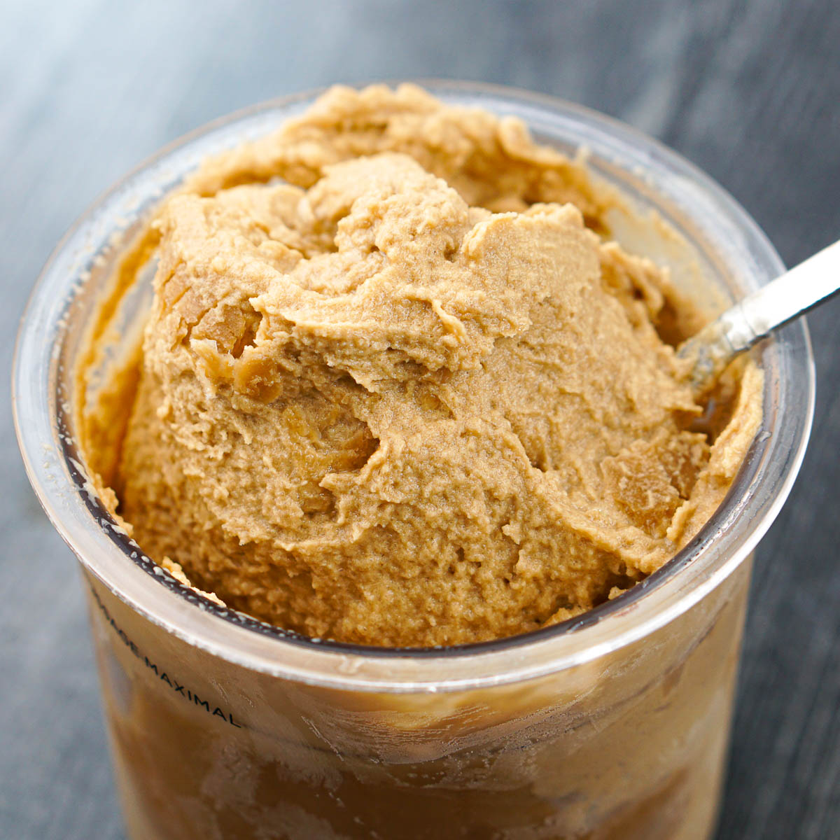 closeup of container of keto Ninja creami coffee ice cream with spoon