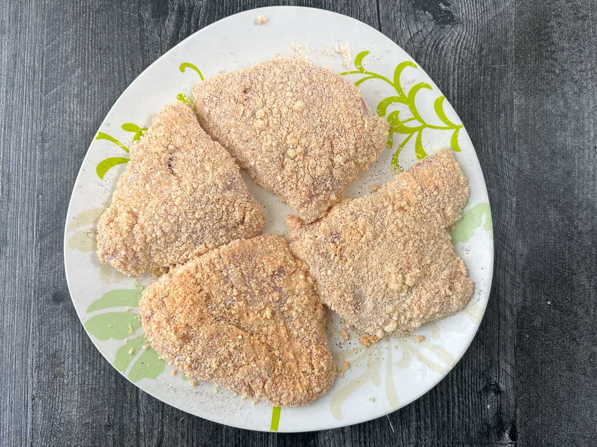 plate with parmesan breaded chicken breast