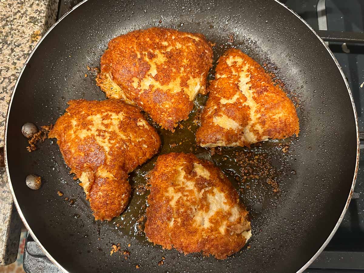 pan with friend pieces of chicken