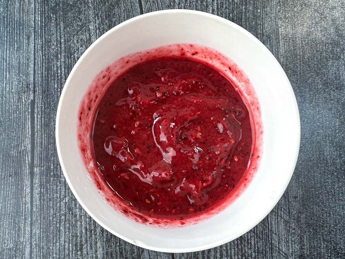 white bowl with berry sauce